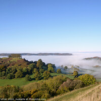 Buy canvas prints of Mist Rising over Downham Hill & Cam Peak, Dursley by Tracey Turner