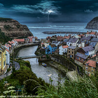 Buy canvas prints of Dramatic Stormy Night in Staithes by Tracey Turner