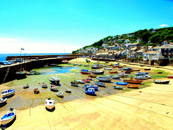 Mousehole harbour at low tide in Cornwall Picture Board by john hill