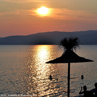 Buy canvas prints of Sunset at Agia Eleni beach on  Skiathos in Greece. by john hill