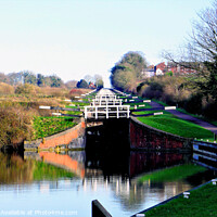 Buy canvas prints of Caen hill canal locks at Devizes in Wiltshire, UK. by john hill