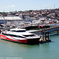 Buy canvas prints of Red jet ferry at West Cowes on the Isle of Wight. by john hill