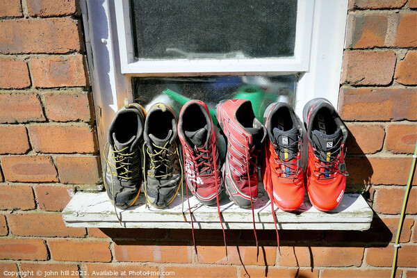 Running trainers out to dry. Picture Board by john hill