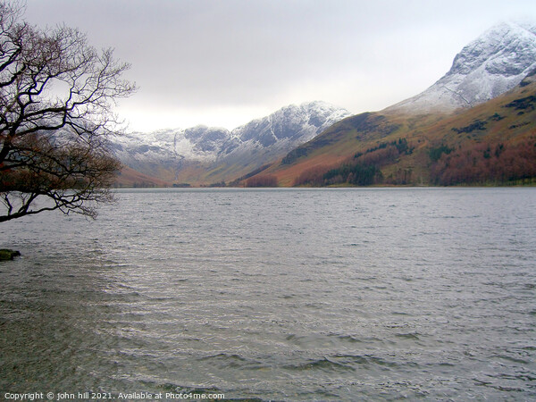 Snow Capped mountains at Buttermere Lake Picture Board by john hill