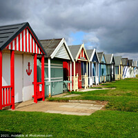 Buy canvas prints of Stormy Skies over beach huts. by john hill