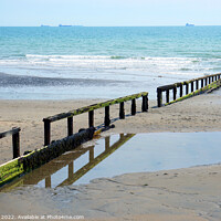 Buy canvas prints of Single Groyne and Marker at Low tide. by john hill