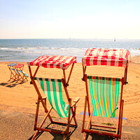 Buy canvas prints of Deckchairs in portrait. by john hill