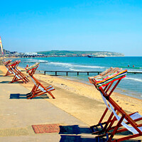 Buy canvas prints of Early morning deckchairs at Sandown bay, Isle of Wight. by john hill