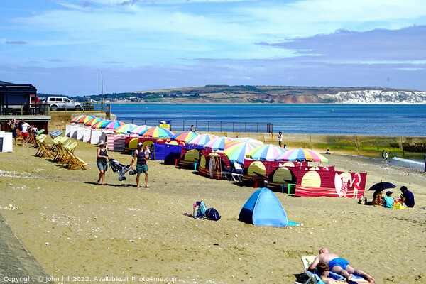 Line of Parasols on Shanklin beach on the Isle of Wight. Picture Board by john hill