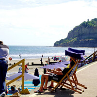 Buy canvas prints of Relaxation, Clock tower beach Shanklin, Isle of Wight. by john hill