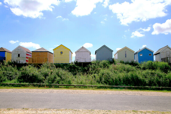 Silhouetted beach huts at Chapel point. Picture Board by john hill