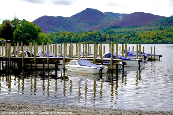 Jetty reflections on Derwentwater Keswick Cumbria Picture Board by john hill