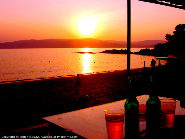Sunset across the sea at Agia Eleni beach Skiathos, Greece. Picture Board by john hill