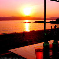 Buy canvas prints of Sunset across the sea at Agia Eleni beach Skiathos, Greece. by john hill