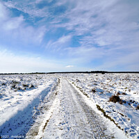 Buy canvas prints of Snow covered view and windy sky at stanage edge. by john hill