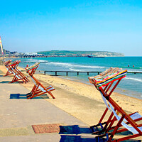 Buy canvas prints of Early morning deckchairs at Sandown bay, Isle of Wight. by john hill