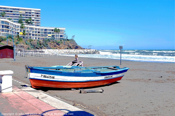 Beached rowboat, Torremolinos, Spain. Picture Board by john hill