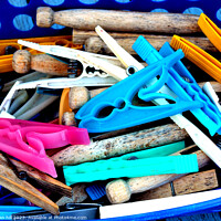 Buy canvas prints of Assortment of clothes pegs by john hill