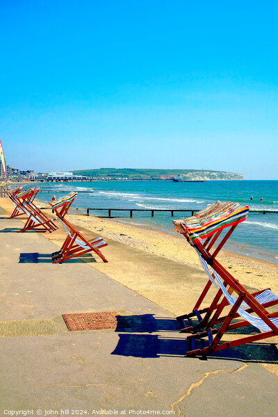 Early morning deckchairs at Sandown bay, Isle of Wight. Picture Board by john hill
