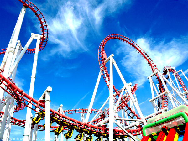 Roller coaster against blue sky. Picture Board by john hill
