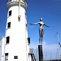 Buy canvas prints of Harbour lighthouse and bathing belle statue at Scarborough. by john hill
