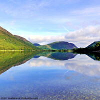 Buy canvas prints of Reflections in Buttermere lake with Mellbreak mountain in Cumbria.  by john hill