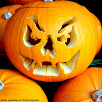 Buy canvas prints of Carved Pumpkin of gruesome face. by john hill