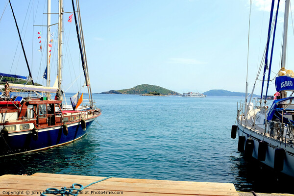 Skiathos bay taken from the marina at Skiathos tow Picture Board by john hill