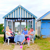 Buy canvas prints of Beach hut tea party on the promenade at Sutton on Sea in Lincolnshire. by john hill