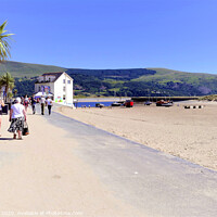 Buy canvas prints of Promenade and beach at Barmouth in Wales.  by john hill