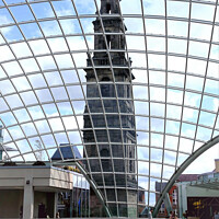 Buy canvas prints of The Holy St. Trinity church seen through shopping centre roof at Leeds in Yorkshire. by john hill