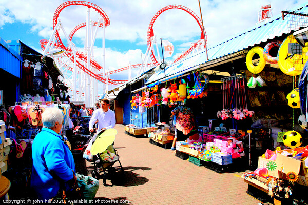 Ingoldmells outdoor market with funfair behind at Skegness in Lincolnshire. Picture Board by john hill