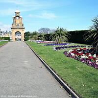 Buy canvas prints of The Holbeck clock tower and South cliff gardens at Scarborough in Yorkshire.  by john hill