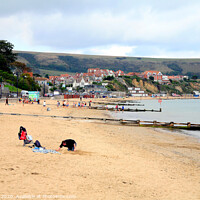 Buy canvas prints of Swanage beach during October in Dorset. by john hill
