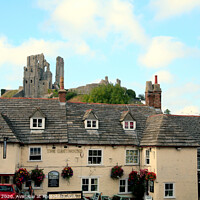 Buy canvas prints of Corfe Castle from the town square in Dorset. by john hill