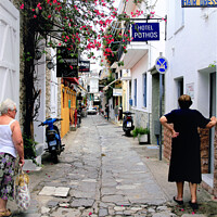 Buy canvas prints of Back street in Skiathos town at Skiathos Island in Greece. by john hill
