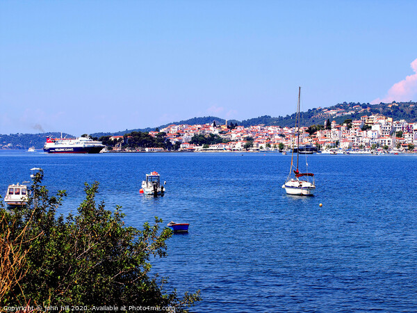 Skiathos town from across the bay on Skiathos Island in Greece. Picture Board by john hill