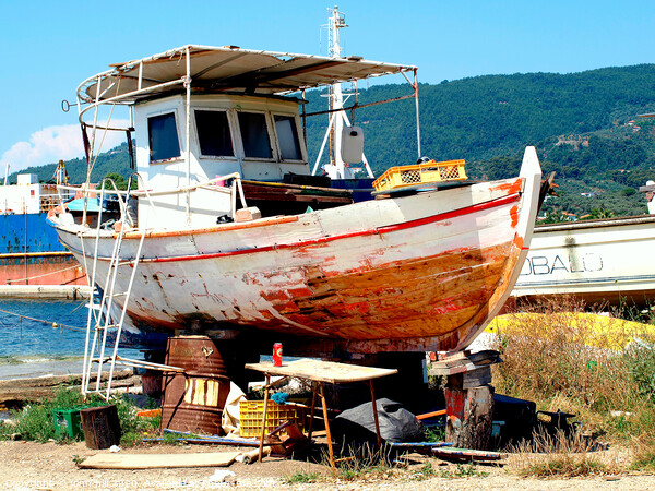 Greek fishing boat having service in Dry dock. Picture Board by john hill