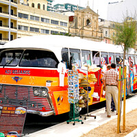 Buy canvas prints of Souvenir bus on the seafront at Silema in Malta. by john hill