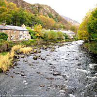 Buy canvas prints of Tha river at Beddgelert village in Wales. by john hill