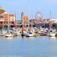 Buy canvas prints of Harbour marina and funfair at Scarborough in Yorkshire.  by john hill