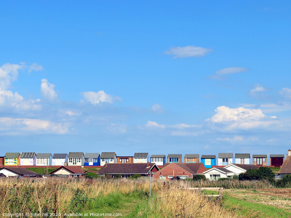 The backs of beach huts at Sandilands in Lincolnshire Picture Board by john hill