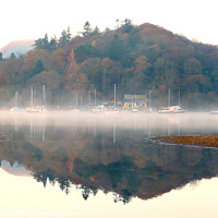 Buy canvas prints of Yachts in the mist at Derwent Water in Cumbria. by john hill