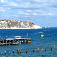 Buy canvas prints of Old  & New piers at Swanage in Dorset. by john hill
