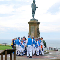 Buy canvas prints of Morris dancers take a break under Thomas Cook statue by john hill