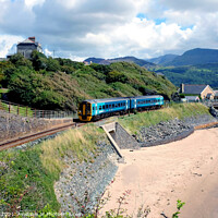Buy canvas prints of Coastal train at Barmouth in Wales. by john hill