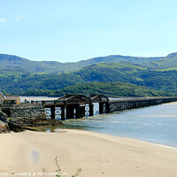 Buy canvas prints of Barmouth rail bridge in Wales. by john hill