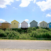 Buy canvas prints of Behind the Beach Huts Silhouette. by john hill