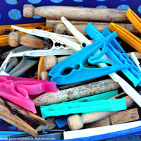 Buy canvas prints of Assortment of clothes pegs by john hill