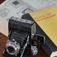 Buy canvas prints of Vintage folding camera by Bernard Rose Photography